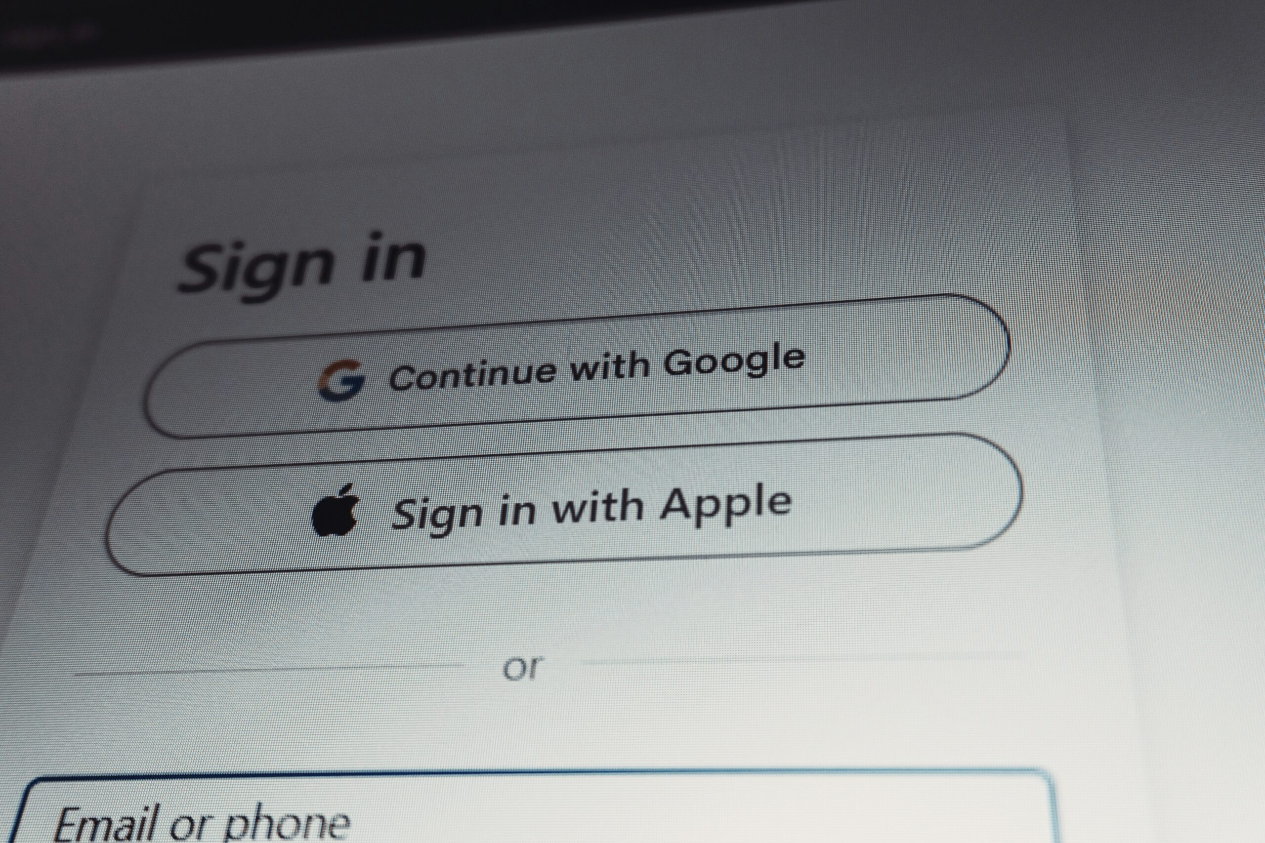Tela de login com opções de autenticação via Google e Apple representando federação social no Amazon Cognito